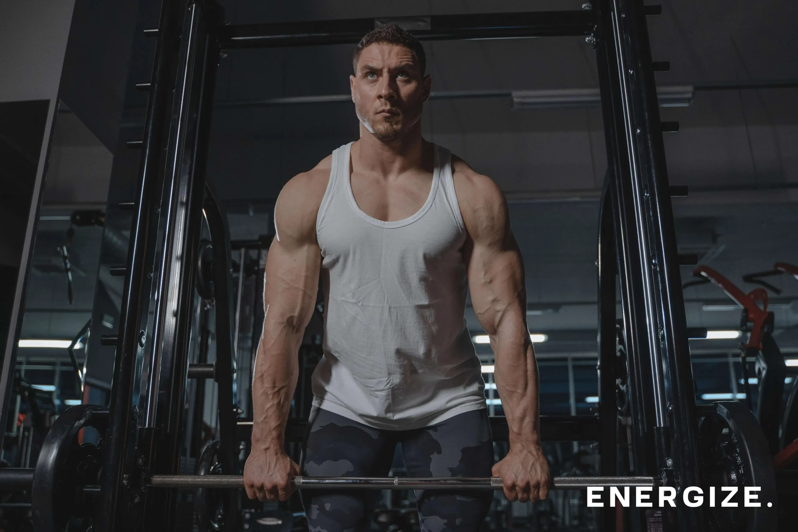 man performing a deadlift at the gym